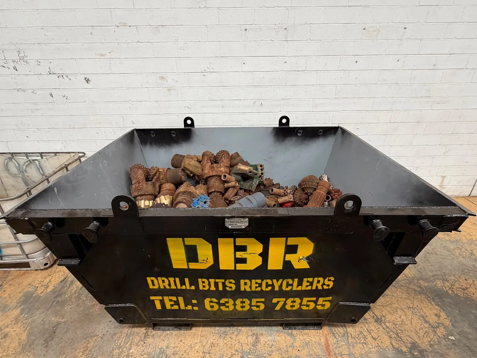 DBR collection bin filled with worn tricone and DTH bits