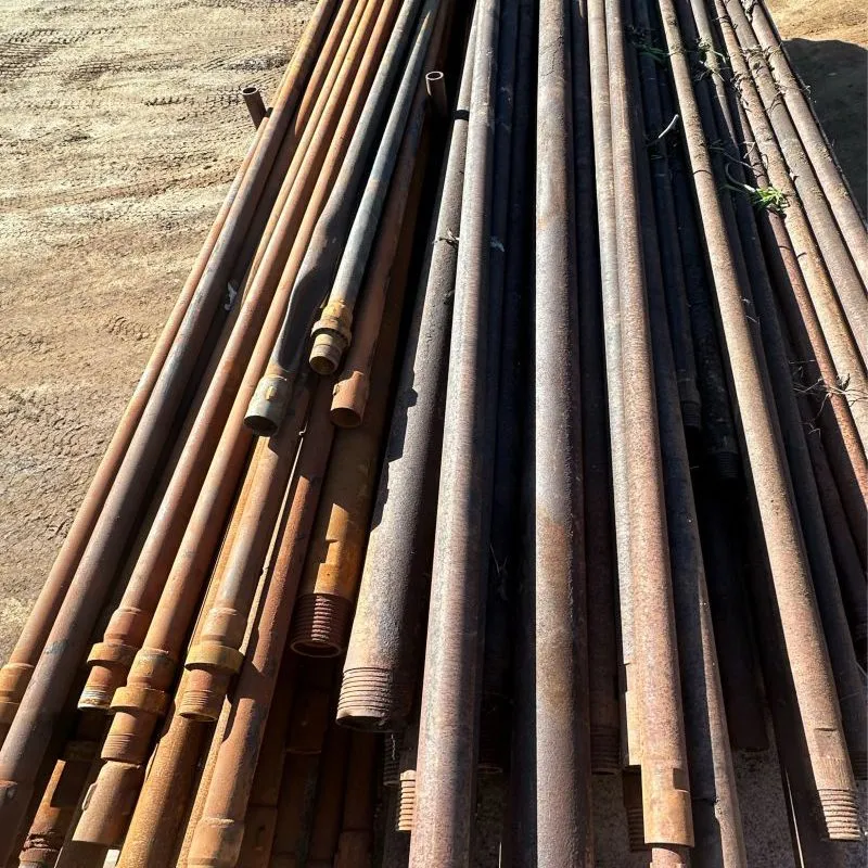 Used drill rods stacked for recycling