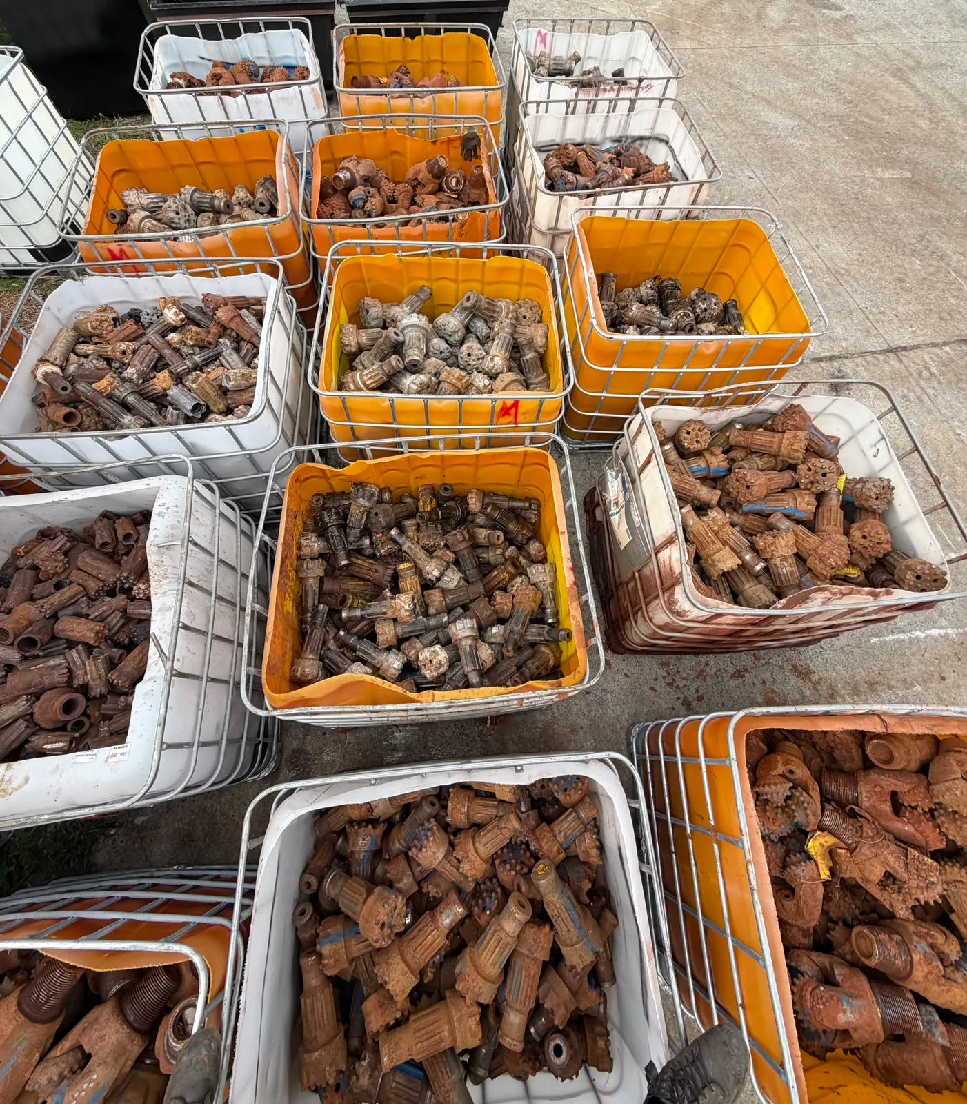 Sorted bins of drill bits and drilling consumables separated by type