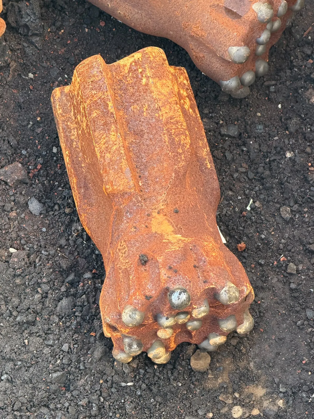 Close-up of a worn tungsten carbide button bit